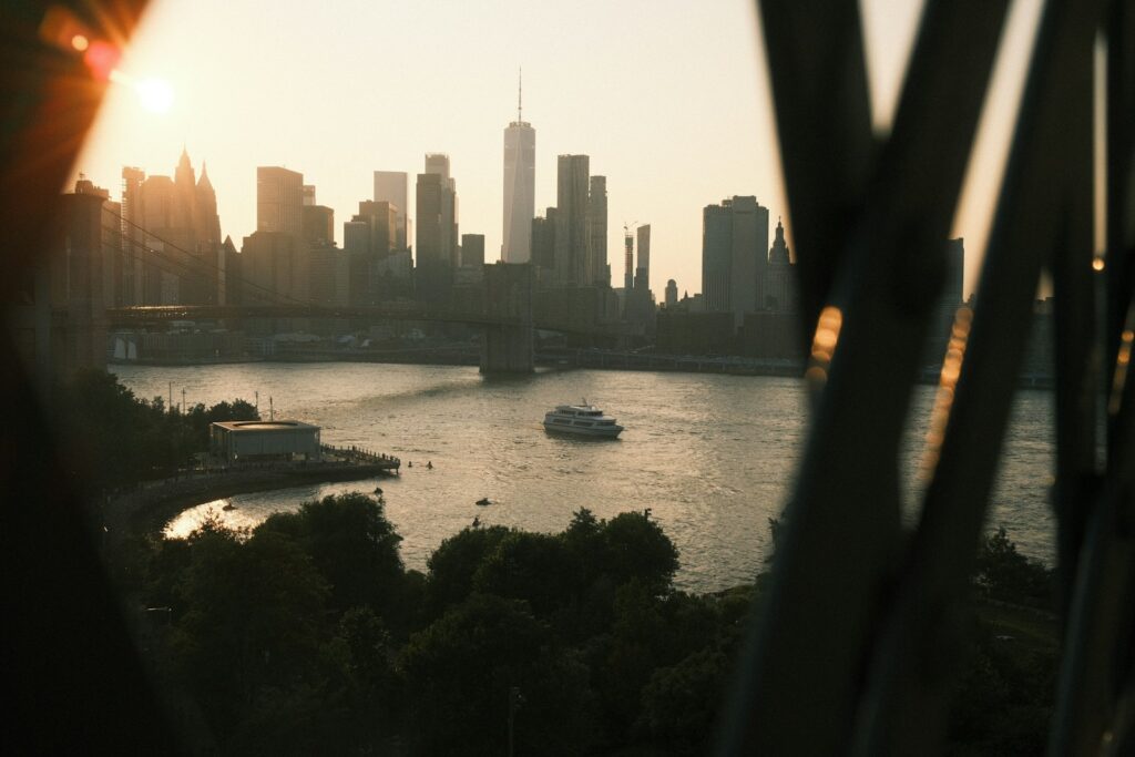 New york city skyline seen across the water at sunset.
