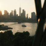 New york city skyline seen across the water at sunset.